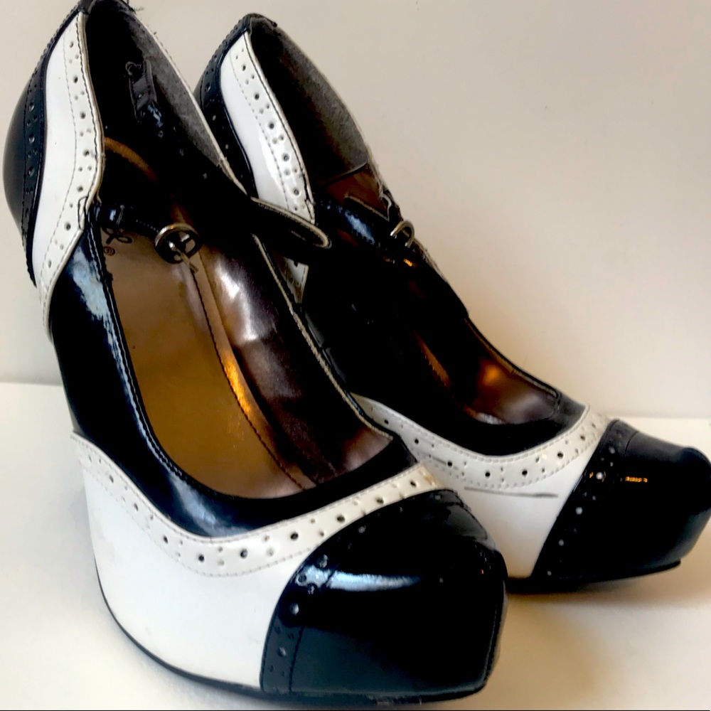 Black and white saddle shoe pumps